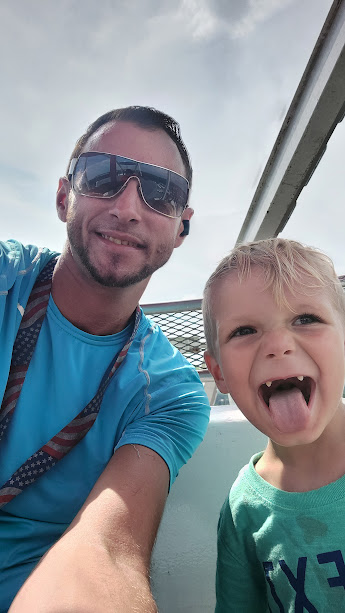 Corey King spending time with his child near the water