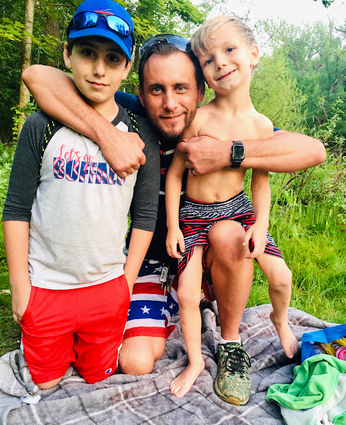 Corey King with his children outdoors